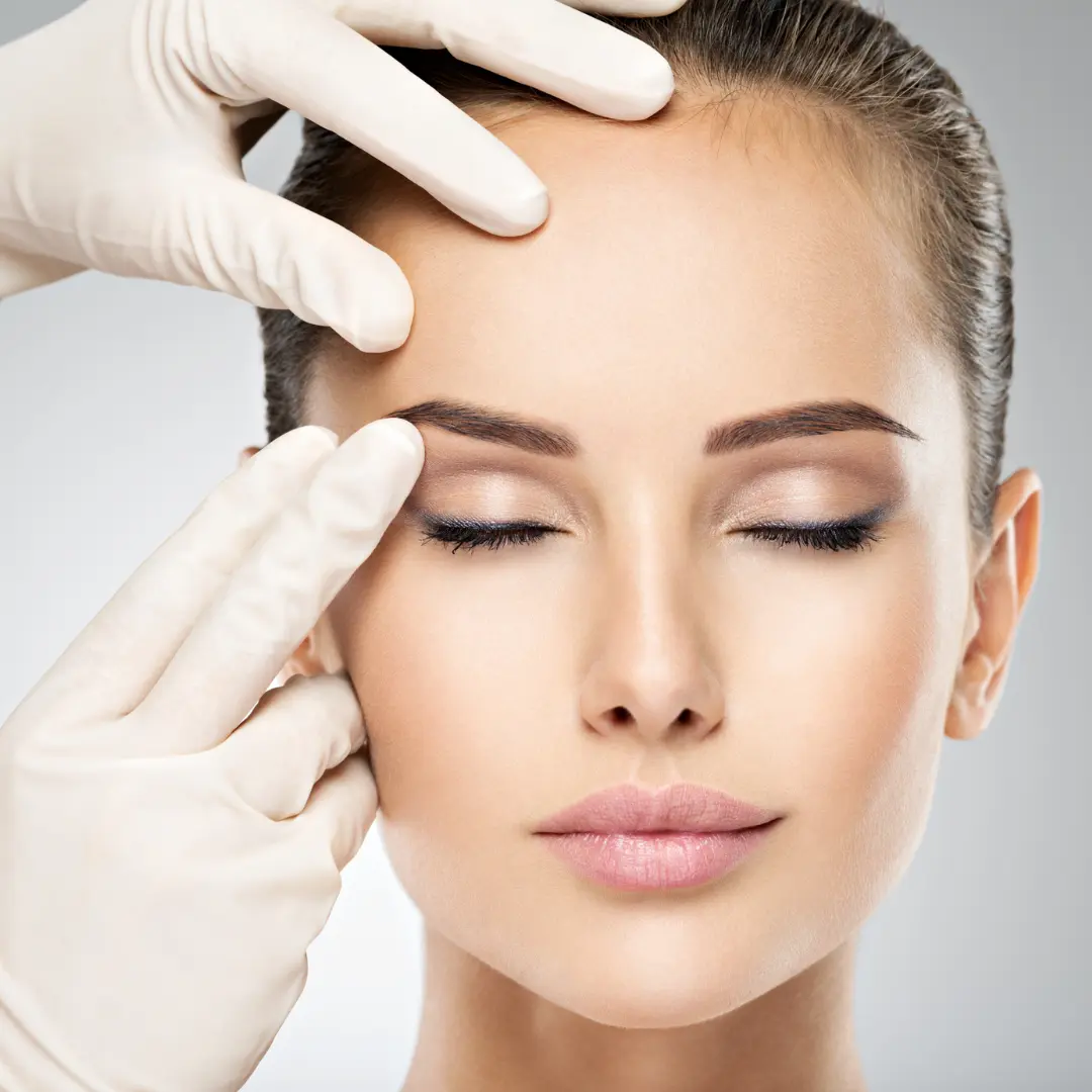 Eye Surgeon marking around the eyes, before the Blepharoplasty surgery dubai.